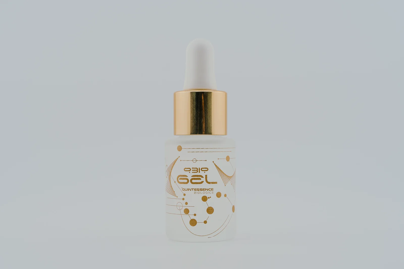 A gold-collar QBio Gel bottle with a white dropper.