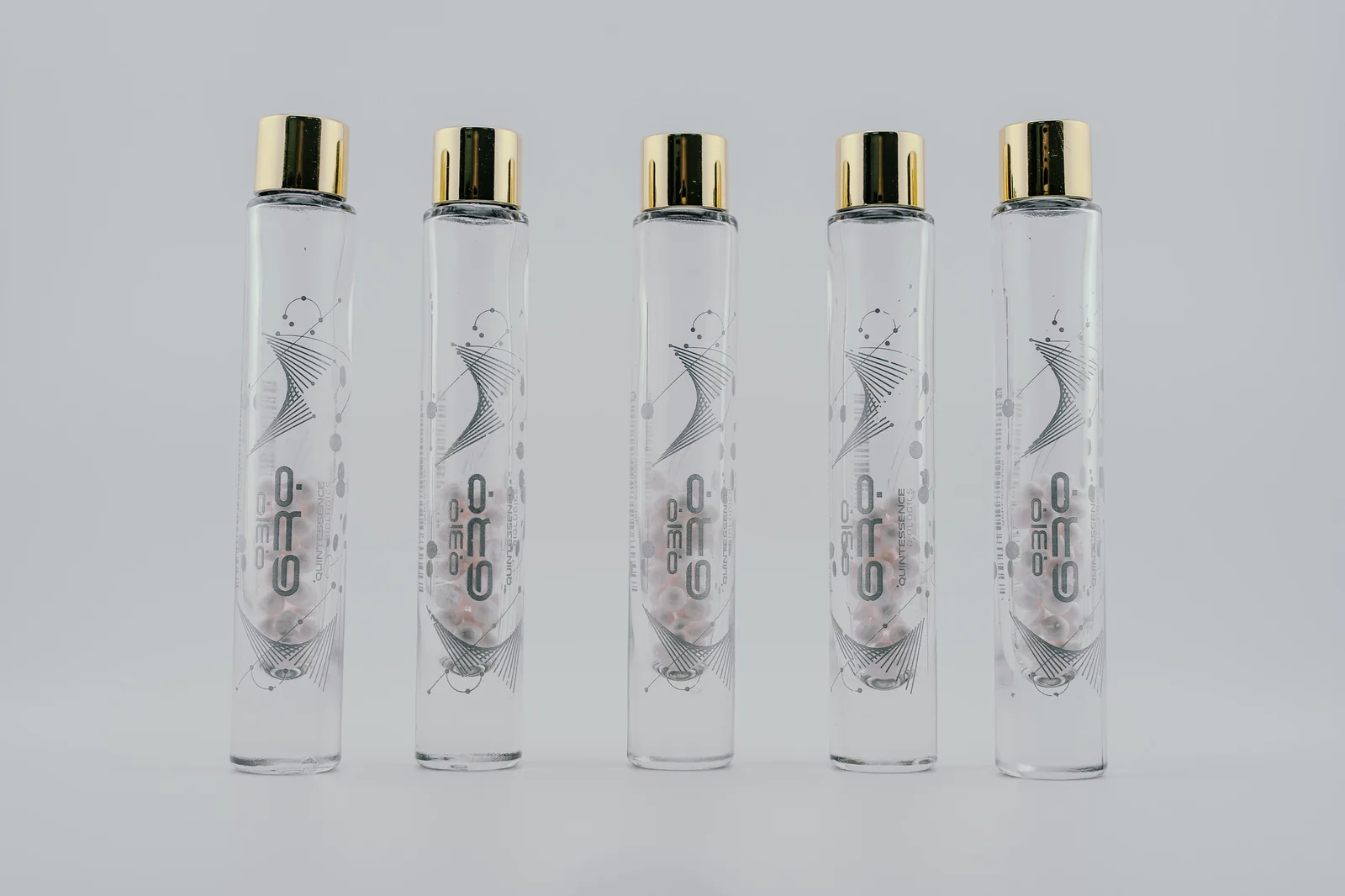 Five individually spaced QBio Gro vials with their front labels visible.